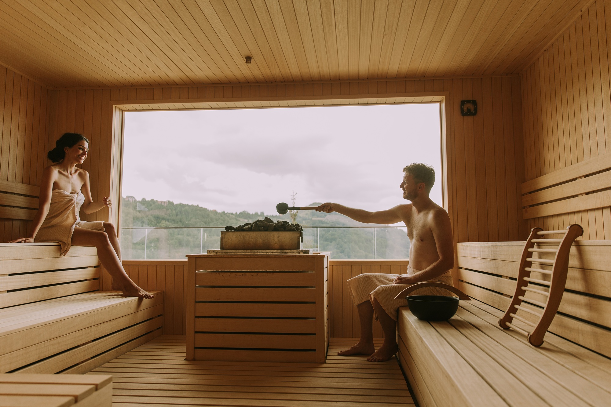 Young couple relaxing in the sauna